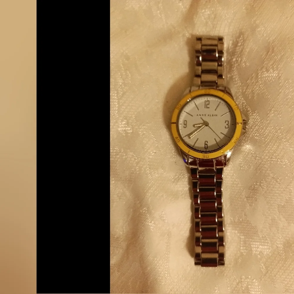 Anne Klein white face outer yellow/ tan second silver tone women's watch